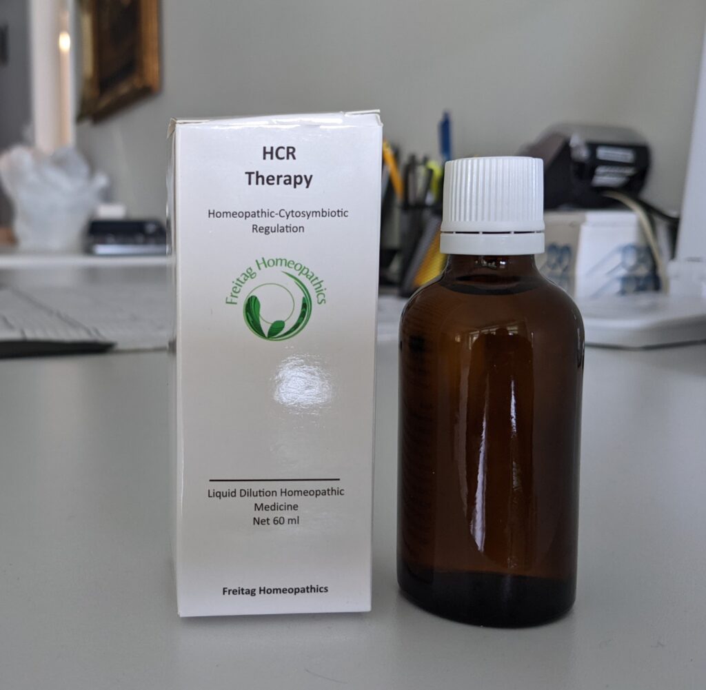 Brown bottle beside white product box